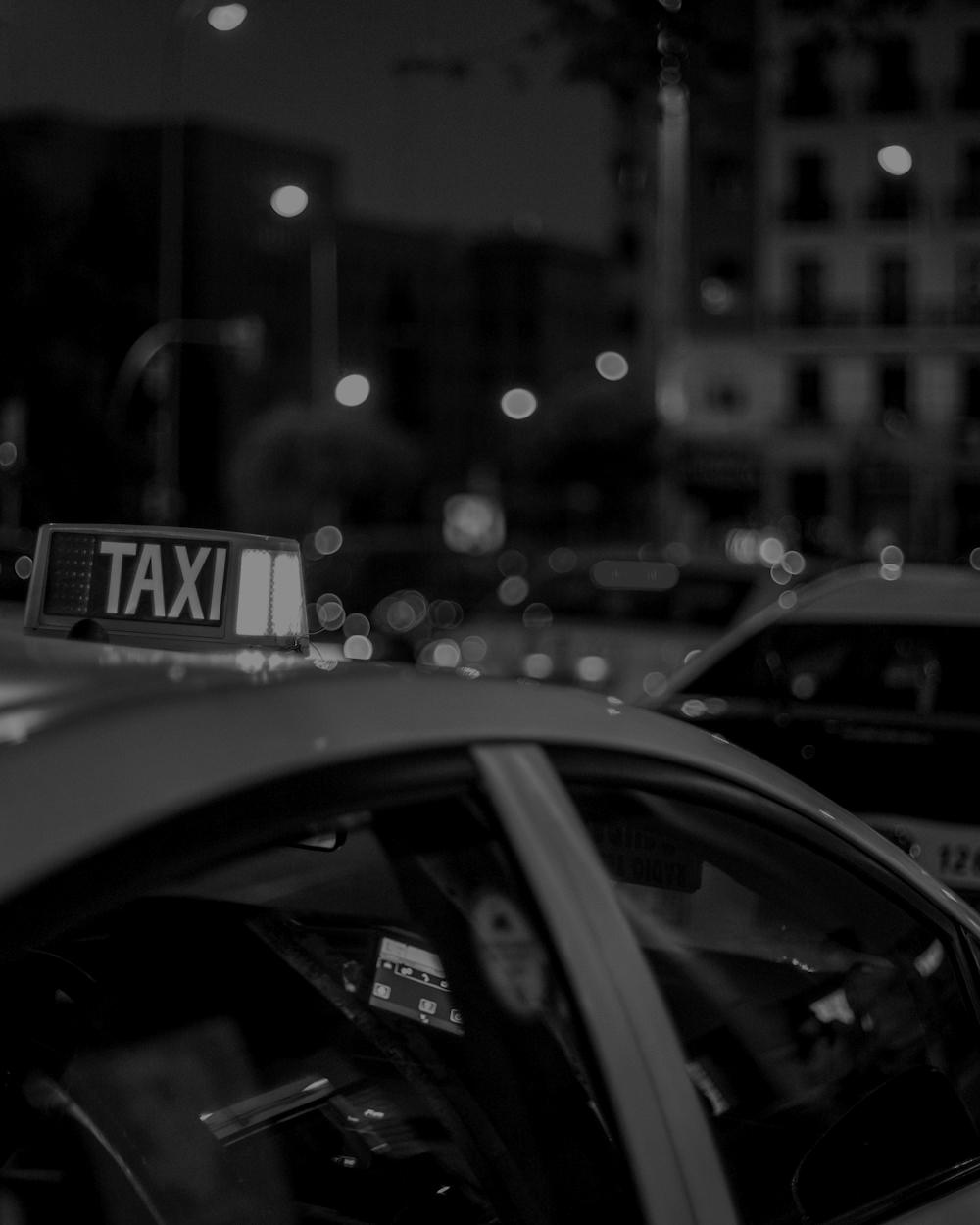 Taxi on a city street at night